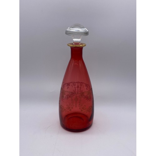 277 - RUBY GLASS AND GILT ETCHED MALLET DECANTER AND STOPPER