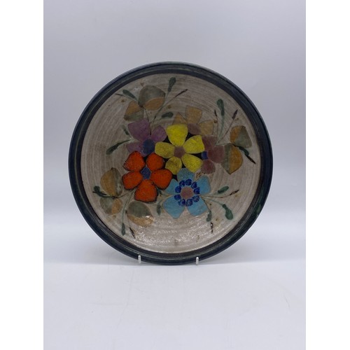 228 - PORTUGUESE POTTERY SHALLOW BOWL DECORATED WITH FLOWERS