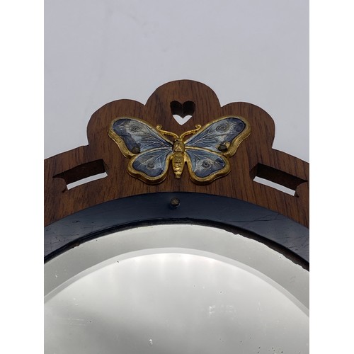 461 - ART NOUVEAU WOODEN AND BUTTERFLY APPLIED DECORATIVE BACKED HAND MIRROR