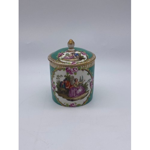 435 - 18TH CENTURY CHOCOLATE CUP AND COVER PAINTED WITH COURTING COUPLE IN GILT CARTOUCHE