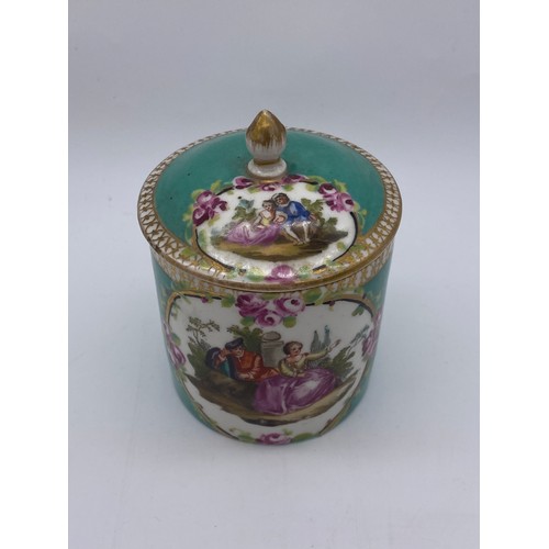 435 - 18TH CENTURY CHOCOLATE CUP AND COVER PAINTED WITH COURTING COUPLE IN GILT CARTOUCHE