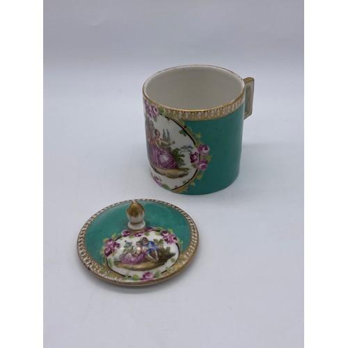 435 - 18TH CENTURY CHOCOLATE CUP AND COVER PAINTED WITH COURTING COUPLE IN GILT CARTOUCHE