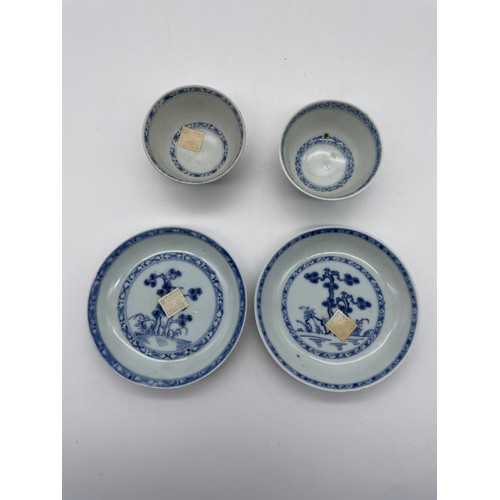 588 - PAIR OF CH-ING DYNASTY BLUE AND WHITE CHINESE EXPORT NANKING CARGO PINE TREE TEA BOWLS AND SAUCERS W... 