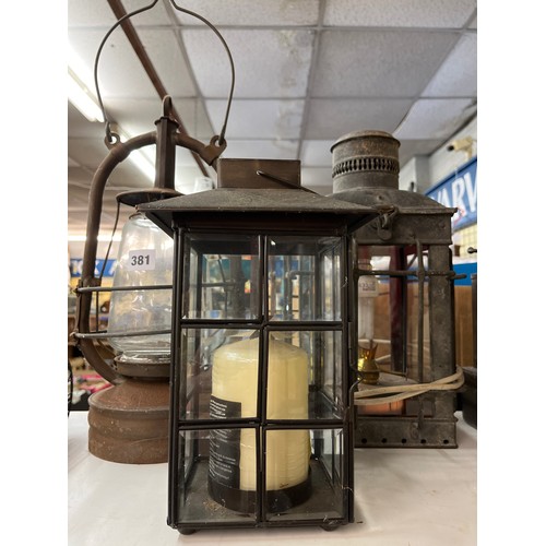 381 - VINTAGE HURRICANE LAMP, CANDLE LANTERN, AND A ELECTRIFIED RAILWAY LANTERN