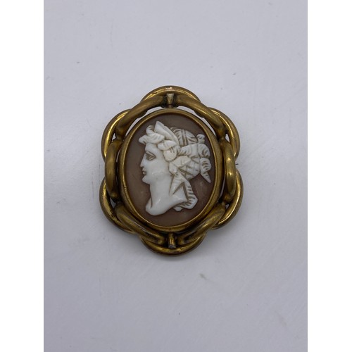 572 - VICTORIAN GILT METAL CARVED SWIVEL CAMEO BROOCH AND A JET CAMEO BROOCH