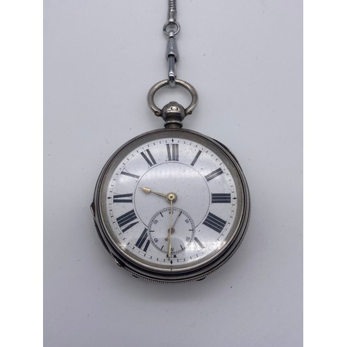 569 - BIRMINGHAM SILVER CASED POCKET WATCH WITH A PLATED ALBERT CHAIN AND WATCH KEY