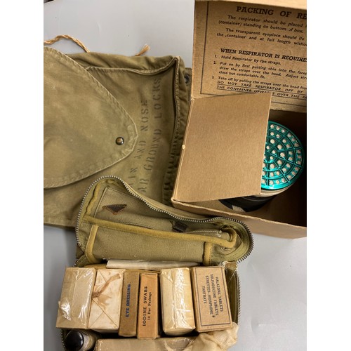 550 - WWII GAS MASK, AND A MILITARY FIRST AID KIT IN CANVAS BAG