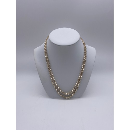 365 - TWO STRAND SIMULATED PEARL CHOKER WITH 9CT GOLD CLASP