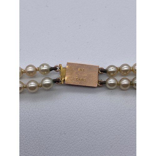 365 - TWO STRAND SIMULATED PEARL CHOKER WITH 9CT GOLD CLASP