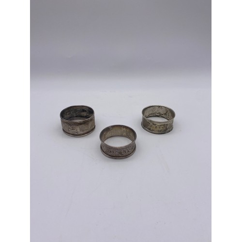 357 - THREE SILVER NAPKIN RINGS 1.06OZ APPROX