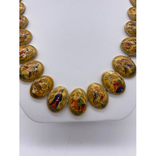 439 - POLYCHROME PAINTED OVAL BONE STRUNG NECKLACE