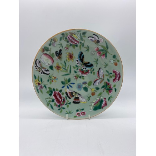 503 - CHINESE EXPORT FAMILLE ROSE PLATES PAINTED WITH BUTTERFLIES AND A SMALLER SAUCER DISH