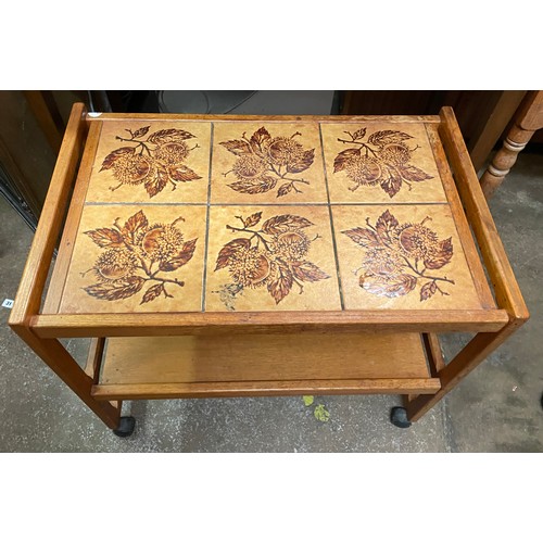 140 - TEAK AND TILE TOP TROLLEY TABLE