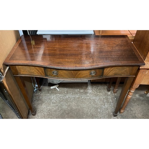 142 - REPRODUCTION GEORGE III STYLE MAHOGANY CROSS BANDED SERPENTINE SIDE TABLE ON TAPERED LEGS