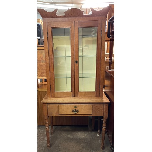 137 - OAK GLAZED CABINET ON STAND