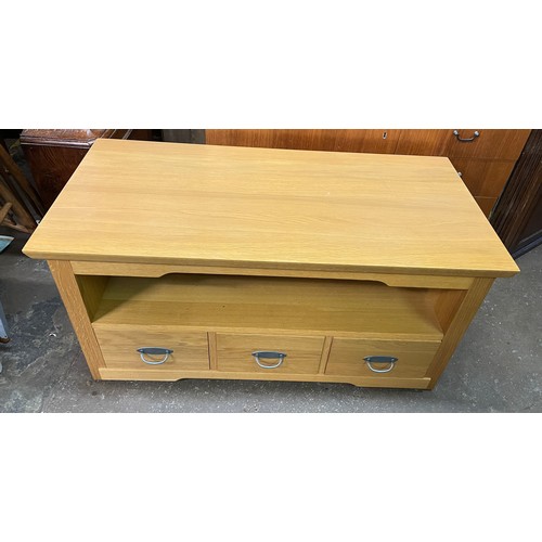 144 - LIGHT OAK MEDIA UNIT FITTED WITH THREE DRAWERS