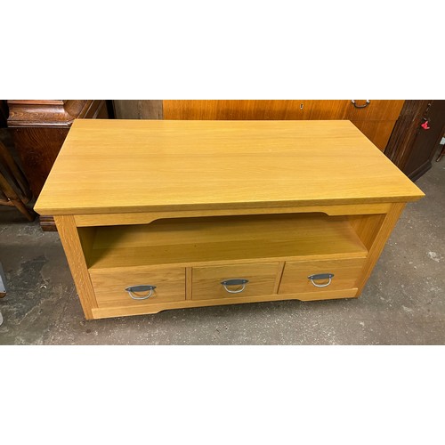 144 - LIGHT OAK MEDIA UNIT FITTED WITH THREE DRAWERS