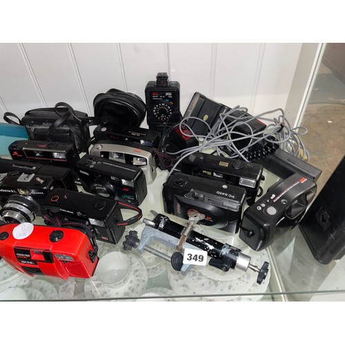 349 - SHELF OF VARIOUS CAMERAS, BINOCULARS, LIGHT METERS AND FLASH