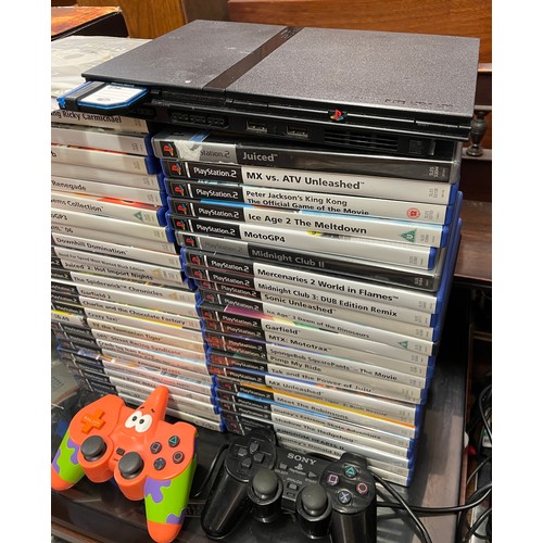 334 - PLAYSTATION II SLIM, CONTROLLERS AND SELECTION OF GAMES