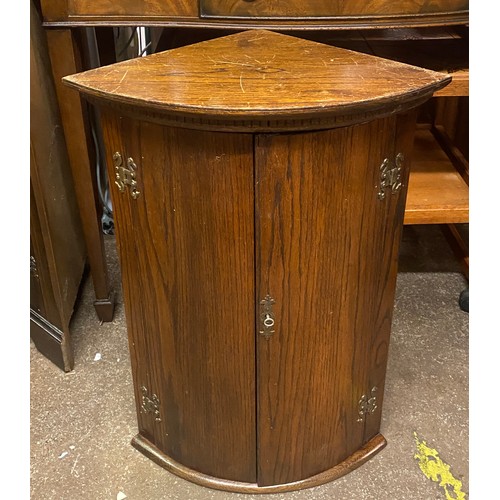 148 - SMALL OAK BOW FRONTED CORNER CABINET