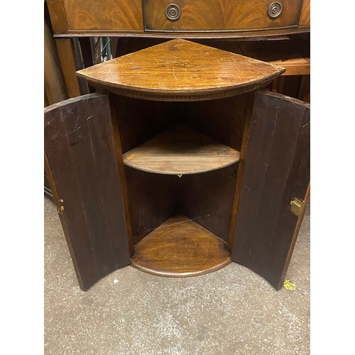 148 - SMALL OAK BOW FRONTED CORNER CABINET