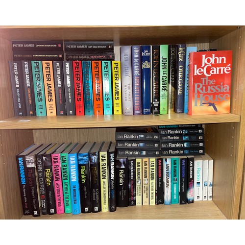 221 - TWO SHELVES OF HARD AND PAPER BACK THRILLER CRIME FICTION JOHN LE CARRE, IAN RANKIN, PETER JAMES