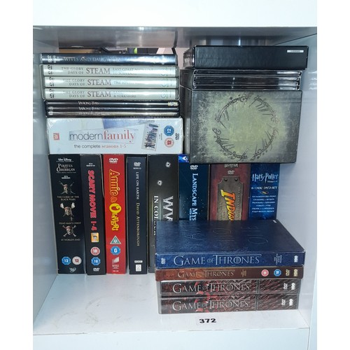 372 - DVD BOX SETS, INDIANA JONES, HARRY POTTER, MODERN FAMILY, LORD OF THE RINGS