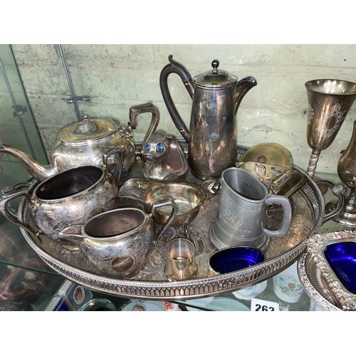 263 - SHELF OF VARIOUS PLATED WARES INC BOTTLE COASTER, HOTWATER JUG, THREE PIECE TEA SERVICE