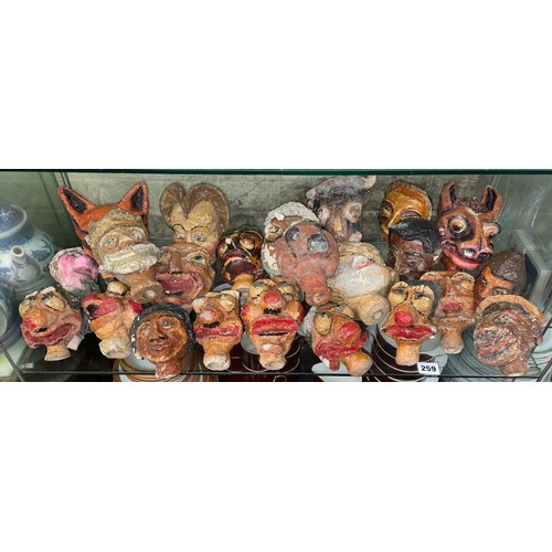 259 - SHELF OF INTERESTING POLYCHROME PAINTED PAPIER MACHE PUPPET HEADS