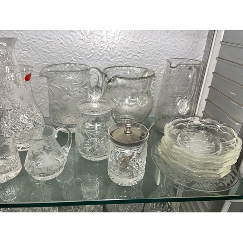 240 - SHELF OF CUT GLASS AND ETCHED FLORAL GLASSWARE INC. HURRICANE LAMP, DRINKING GLASSES, JUGS AND DISHE... 