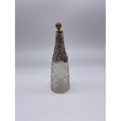 511 - SILVER FILLIGREE SHOULDERED CUT GLASS BOTTLE AND STOPPER