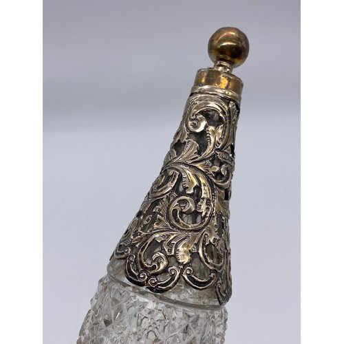 511 - SILVER FILLIGREE SHOULDERED CUT GLASS BOTTLE AND STOPPER