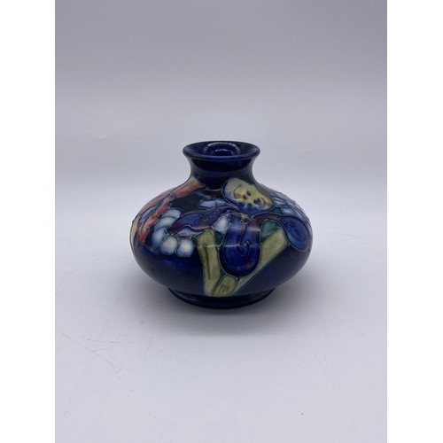 522 - MOORCROFT POTTERY ORCHID SQUAT VASE ON BLUE GROUND