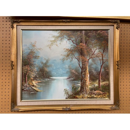 604 - OIL ON CANVAS OF RURAL LAKE MOUNTED IN GILT FRAME