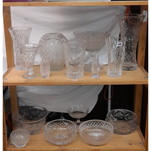 396 - TWO SHELVES OF CUT AND ETCHED GLASS - PEDESTAL BOWLS AND VASE