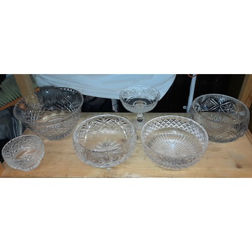 396 - TWO SHELVES OF CUT AND ETCHED GLASS - PEDESTAL BOWLS AND VASE