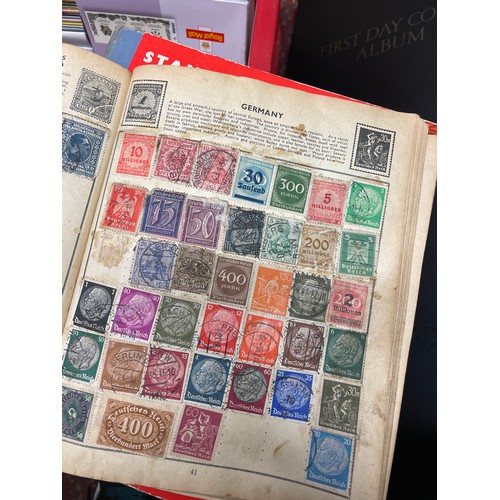 488 - TWO BINDERS OF GB POSTAGE STAMP FIRST DAY COVERS, ROYAL MAIL STAMP LEAFLETS, AND THREE WORLD STAMP A... 