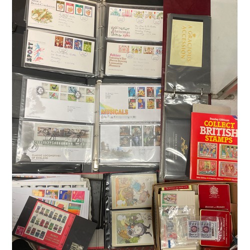 489 - THREE BINDERS OF GB POSTAGE FIRST DAY COVERS, PRESENTATION PACKS, AND POSTCARDS PLUS A BOX OF TINS O... 