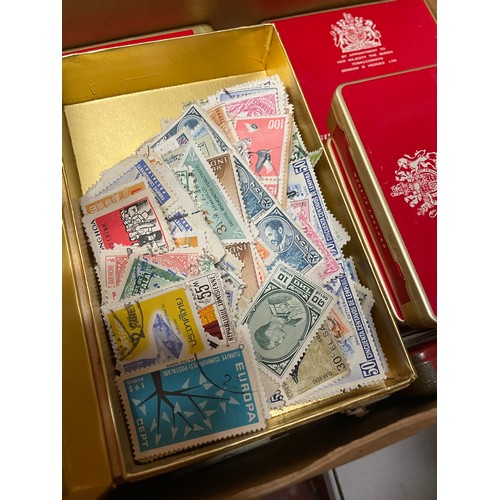 489 - THREE BINDERS OF GB POSTAGE FIRST DAY COVERS, PRESENTATION PACKS, AND POSTCARDS PLUS A BOX OF TINS O... 