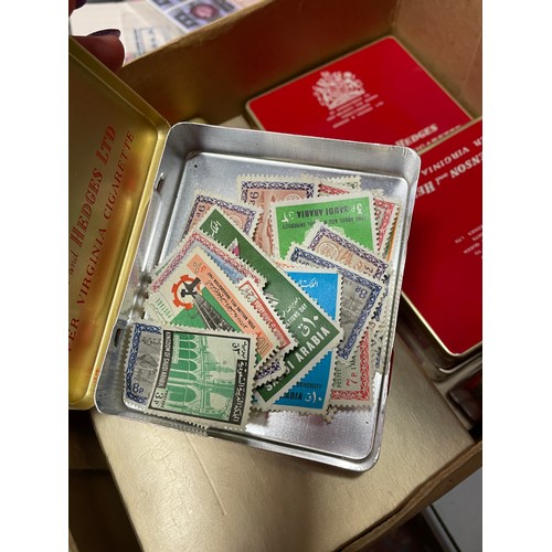 489 - THREE BINDERS OF GB POSTAGE FIRST DAY COVERS, PRESENTATION PACKS, AND POSTCARDS PLUS A BOX OF TINS O... 