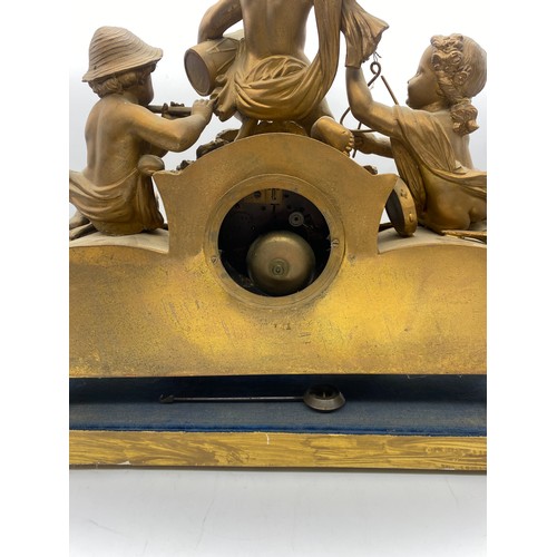 405 - 19TH CENTURY GILDED SPELTER AND PORCELAIN PANELLED CHERUB FIGURAL MANTLE CLOCK