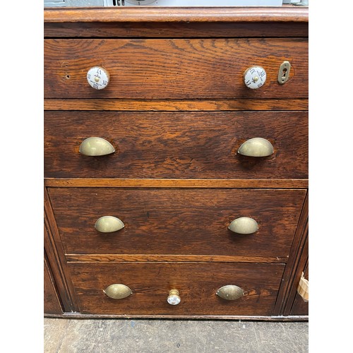 56 - OAK DRESSER BASE WITH FIELDED PANEL CUPBOARD DOORS