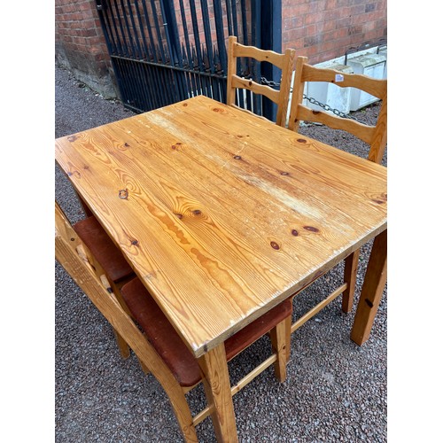 89 - PINE KITCHEN DINING TABLE AND FOUR LADDER BACK CHAIRS