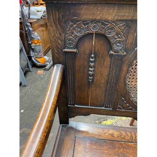 97 - OAK CARVED BERGERE CANED PANEL BACKED BOX SETTLE