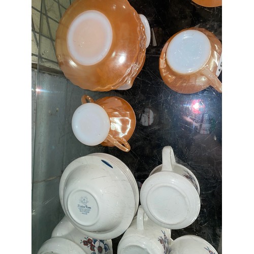 270 - ANCHOR HOCKING LUSTRE GLASS TEACUPS AND SAUCERS AND A FLORAL POTTERY COFFEE SET