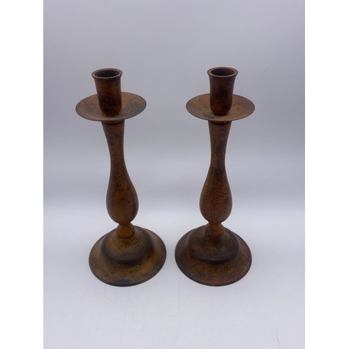 410 - PAIR OF INDIAN METALWARE CANDLE STICKS