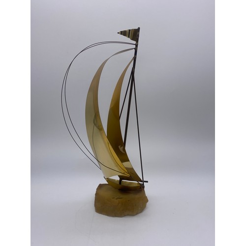 516 - DON DEMOTT BRASS SAIL BOAT ON STONE BASE AND A MODEL OF A GONDOLA