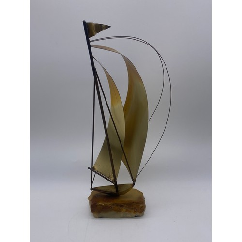 516 - DON DEMOTT BRASS SAIL BOAT ON STONE BASE AND A MODEL OF A GONDOLA