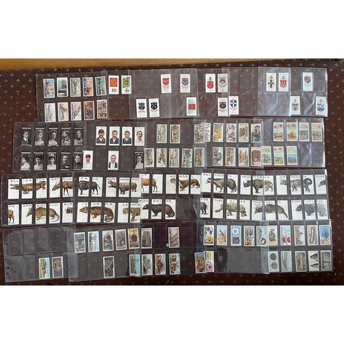 475 - TWO BINDERS OF VARIOUS BRAND CIGARETTE CARDS, FOOTBALLERS, CRICKETERS, SIGNALLING, COUNTRIES, WILD A... 