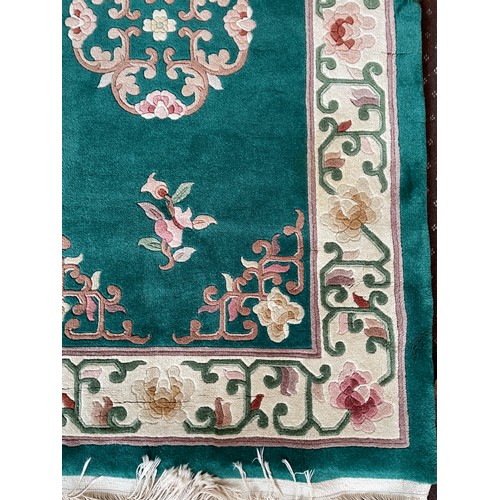 90A - CHINESE WASH WOOLEN RUG WITH CREAM BORDER AND MEDALLION TO CENTRE